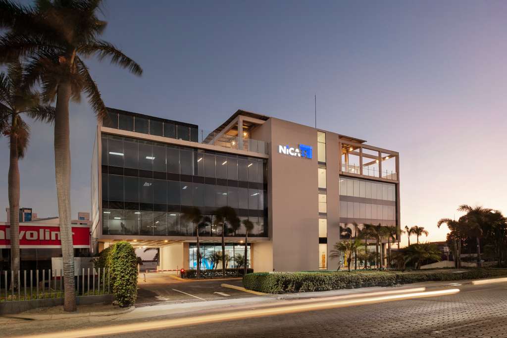 NicaES headquarters exterior at dusk